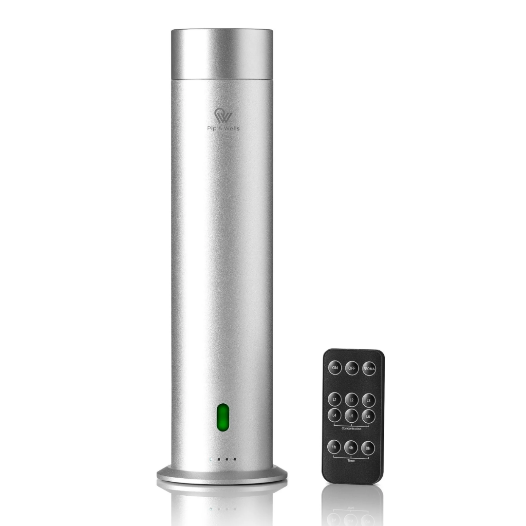Silver Aroma diffuser with remote control on a white background